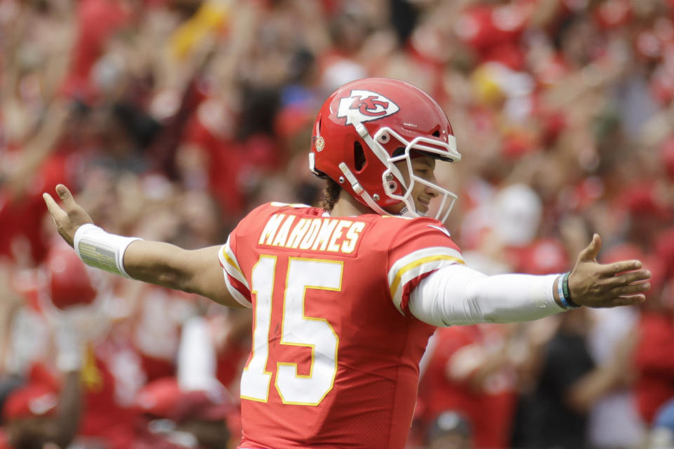 Kansas City Chiefs quarterback Patrick Mahomes (15) reacts after his touchdown pass to wide receiver Demarcus Robinson during the first half of an NFL football game against the Baltimore Ravens in Kansas City, Mo., Sunday, Sept. 22, 2019. (AP Photo/Charlie Riedel)