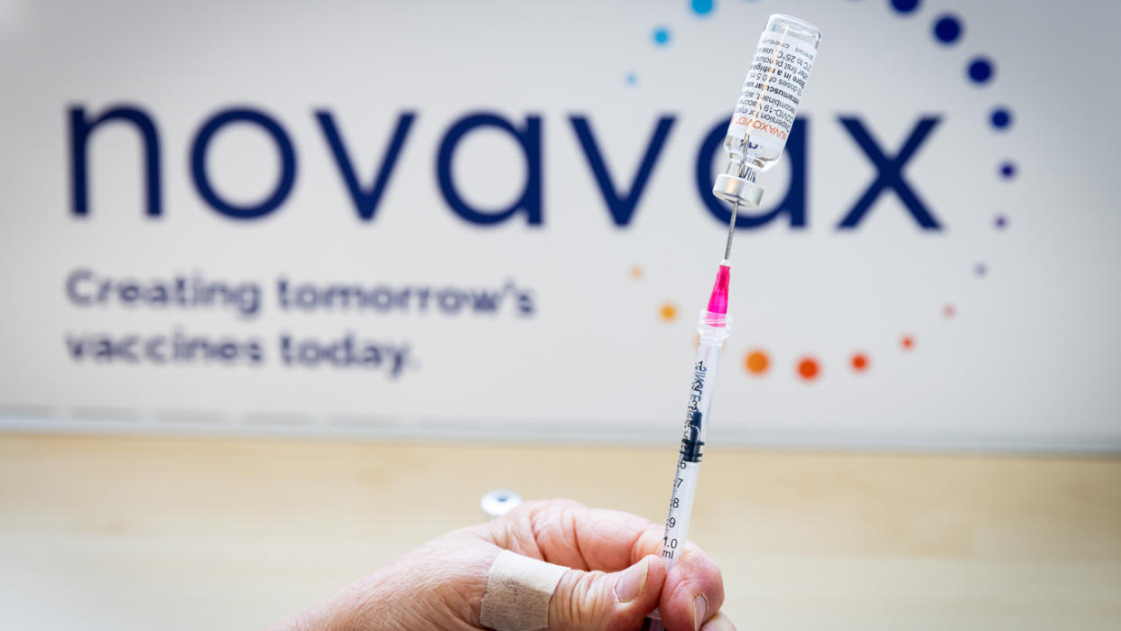 A health worker prepares a dose of the Novavax vaccine as the Dutch Health Service Organization starts with the Novavax vaccination program on March 21, 2022 in The Hague, Netherlands. (Patrick van Katwijk/Getty Images)