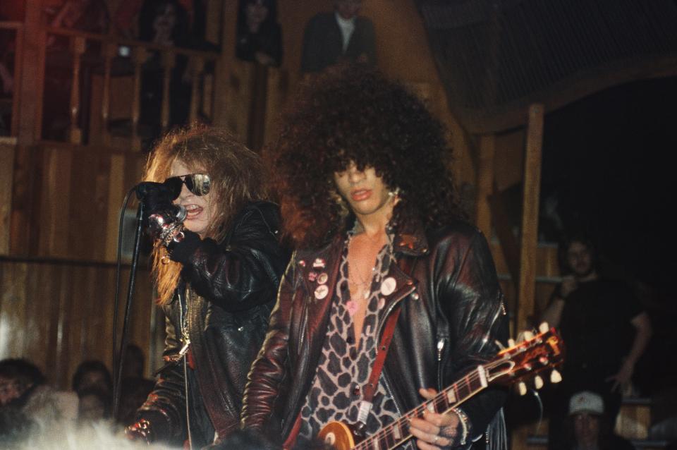 Axl Rose and Slash of Guns N&#39; Roses perform at the Troubadour on the night that Tom Zutaut of Geffen Records, who would later sign them to a record deal, was in attendance. (Photo: Marc S. Canter/Michael Ochs Archives/Getty Images)