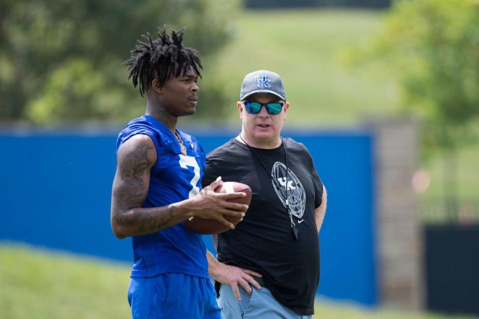 Kentucky Wildcats head coach Mark Stoops talks with wide receiver Barion Brown (7) during Kentucky football annual Fan Day open practice at Joe Craft Football Training Center practice fields in Lexington, Ky, Saturday, August 5, 2023. Silas Walker/Silas Walker/Lexington Herald-Le