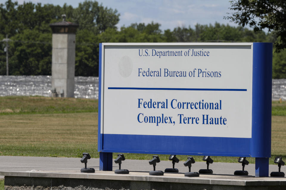 The entrance to the federal prison in Terre Haute, Ind., is shown Monday, July 13, 2020. Daniel Lewis Lee, a convicted killer, was scheduled to be executed at 4 p.m. He was convicted in Arkansas of the 1996 killings of gun dealer William Mueller, his wife, Nancy, and her 8-year-old daughter, Sarah Powell. (AP Photo/Michael Conroy)