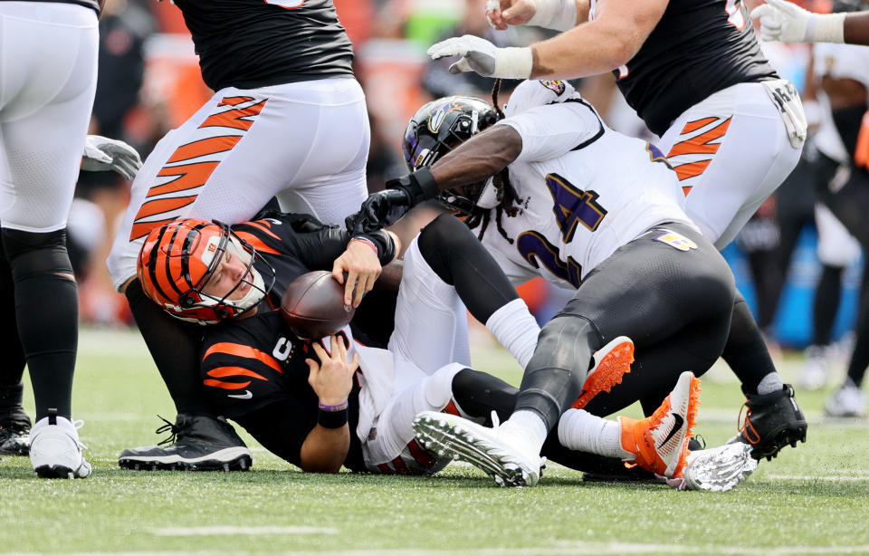 Things have been rough through two games for Joe Burrow (left) and the Bengals' offense. (Photo by Andy Lyons/Getty Images)