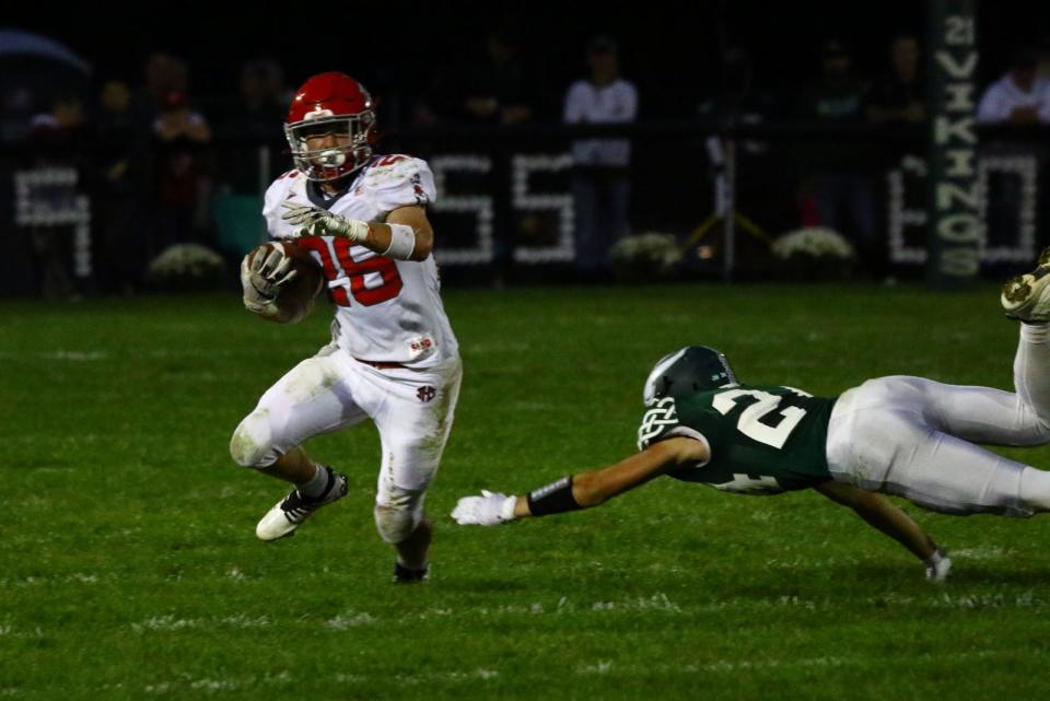 Johnstown senior running back Nathan Sheets eludes the tackle of Northridge senior Brody Booher at Viking Stadium on Friday, Sept. 23, 2022. Sheets ran for five touchdowns to power the visiting Johnnies to a 41-10 victory.