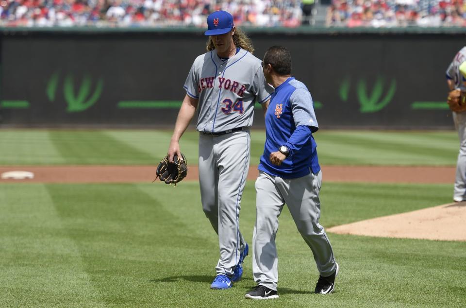 Noah Syndergaard exits with an injury after 1.1 innings in Washington. (AP Photo/Nick Wass)
