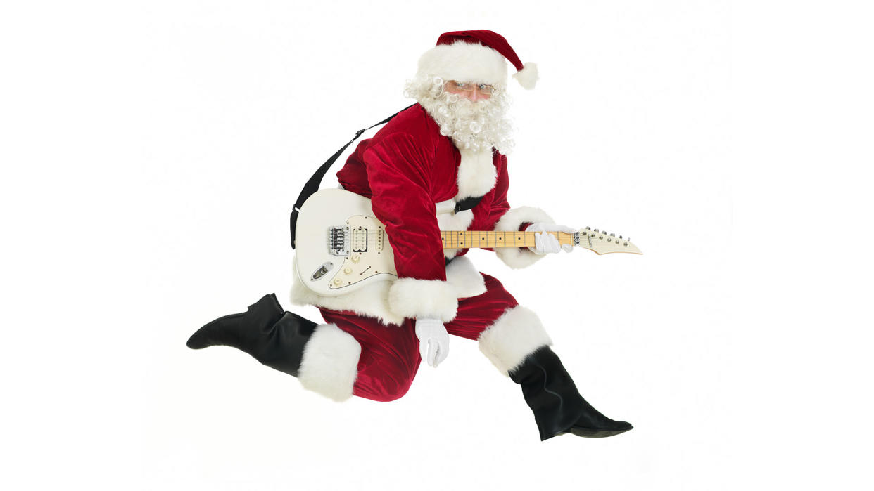  Santa Claus playing guitar. 