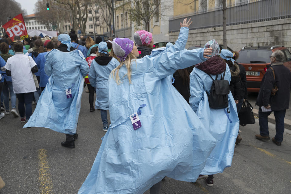 In this photo taken Tuesday Dec.17, 2019 Hospital workers march in Marseille, southern France. In a hospital in Marseille, student doctors are holding an exceptional, open-ended strike to demand a better future. France’s vaunted public hospital system is increasingly stretched to its limits after years of cost cuts, and the interns at La Timone - one of the country’s biggest hospitals - say their internships are failing to prepare them as medical professionals. Instead, the doctors-in-training are being used to fill the gaps. (AP Photo/Daniel Cole)