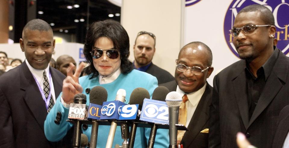 From left, Alvin James, entertainer Michael Jackson, Willie Gary, CEO of the Major Broadcasting Cable Network and actor Chris Tucker pose at the MBC booth Monday, June 9, 2003, at the National Cable and Telecommunications Association show in Chicago. (AP Photo/Stephen J. Carrera)