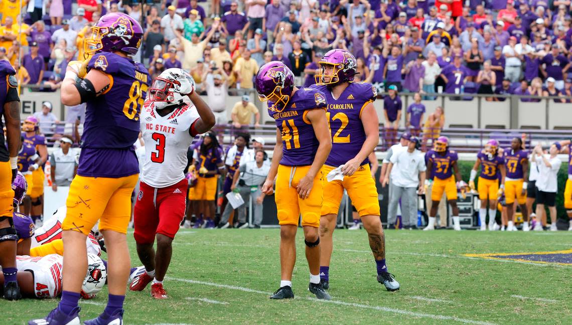 East Carolina’s Owen Daffer (41) reacts after missing a potential game-winning field goal with five seconds left in the game during N.C. State’s 21-20 victory over ECU at Dowdy-Ficklen Stadium in Greenville, N.C., Saturday, Sept. 3, 2022. N.C. State’s Aydan White (3) is to the left.