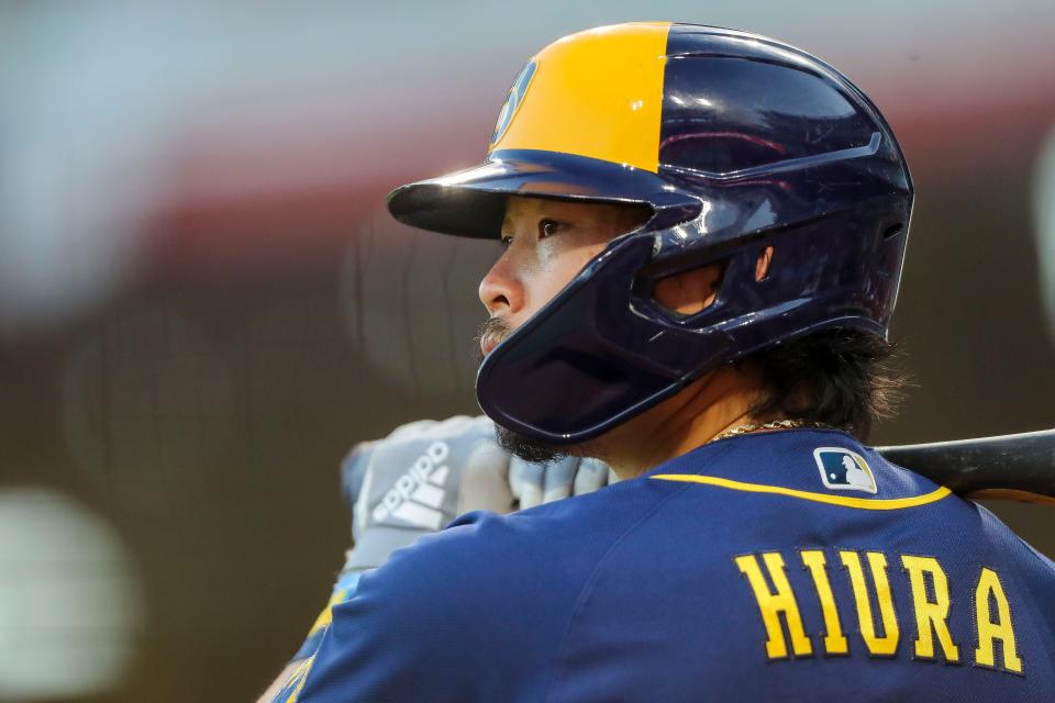 Milwaukee Brewers second baseman Keston Hiura (18) prepares on deck in the seventh inning against the Cincinnati Reds at Great American Ball Park.