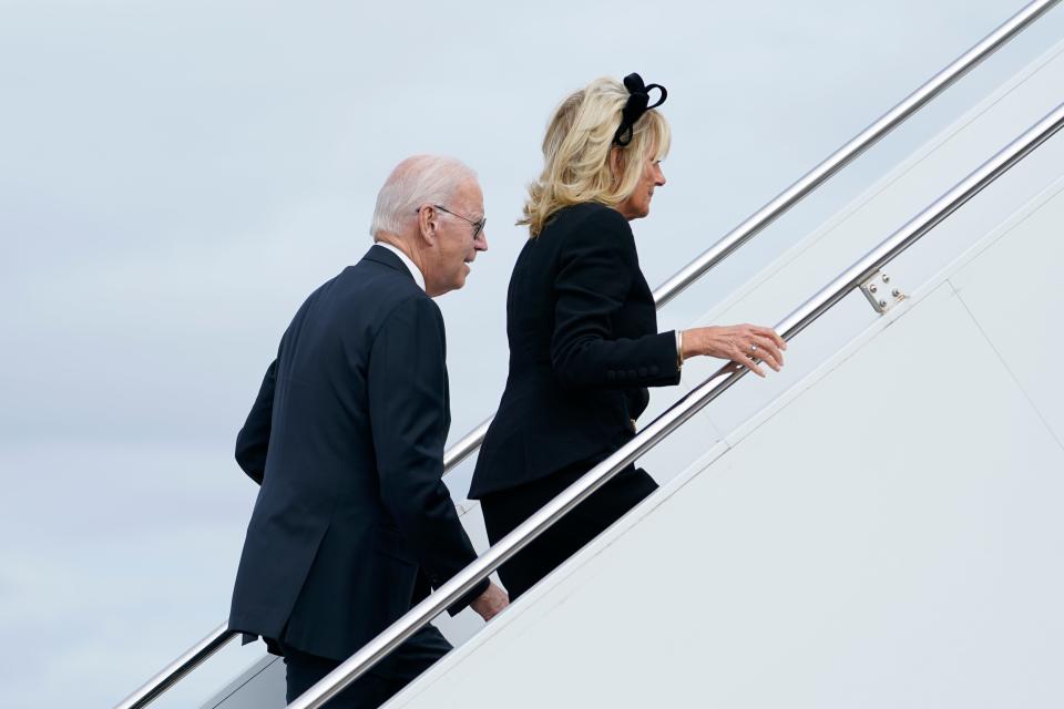 President Joe Biden and first lady Jill Biden walk up the steps of Air Force One at London Stansted Airport, in Stansted, Britain, Monday, Sept. 19, 2022. The Bidens were in London to attend the funeral for Queen Elizabeth II. (AP Photo/Susan Walsh) (AP)