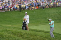 Collin Morikawa chips to the 18th green during the first playoff hole during the final round of the Memorial golf tournament, Sunday, June 6, 2021, in Dublin, Ohio. (AP Photo/Darron Cummings)