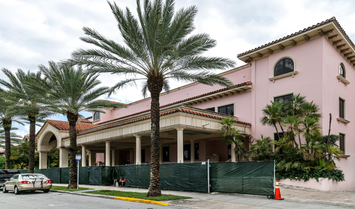 The Palm House hotel property at 160 Royal Palm Way is surrounded by construction fencing in this Nov. 24, 2021 photo.