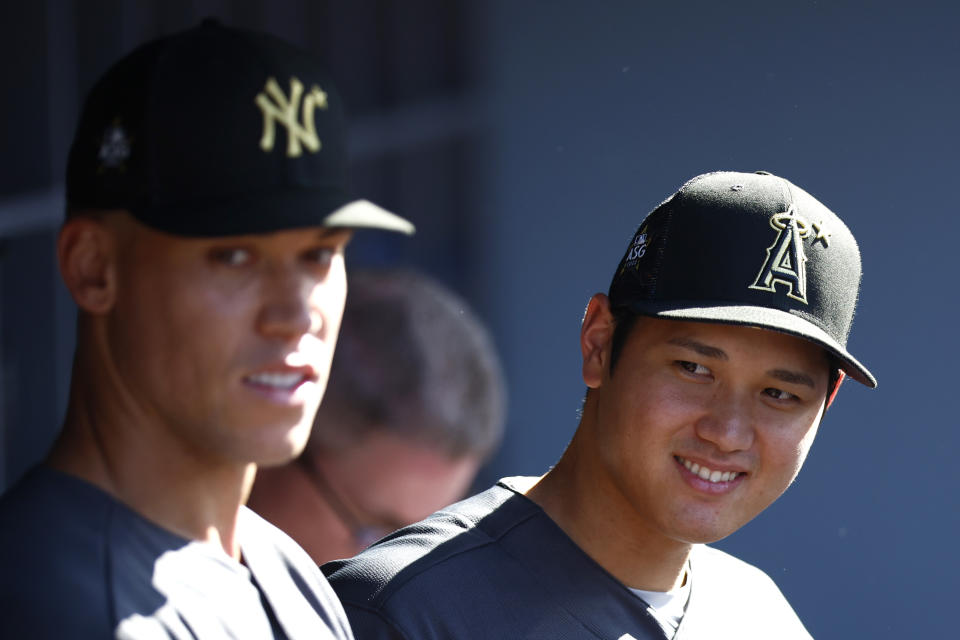 LOS ANGELES, CALIFORNIA - JULY 19: Aaron Judge #99 of the New York Yankees and Shohei Ohtani #17 of the Los Angeles Angels look on from the dugout before the 92nd MLB All-Star Game presented by Mastercard at Dodger Stadium on July 19, 2022 in Los Angeles, California. (Photo by Ronald Martinez/Getty Images)