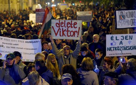 People gather to celebrate after the Hungarian Prime Minister Viktor Orban announced to put Internet tax on hold during a demonstration in the centre of Budapest on October 31, 2014. REUTERS/Laszlo Balogh