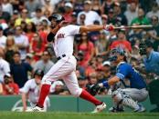Jul 14, 2018; Boston, MA, USA; Boston Red Sox shortstop Xander Bogaerts (2) watches the ball after hitting a walk off grand slam against the Toronto Blue Jays during the tenth inning at Fenway Park. Mandatory Credit: Brian Fluharty-USA TODAY Sports