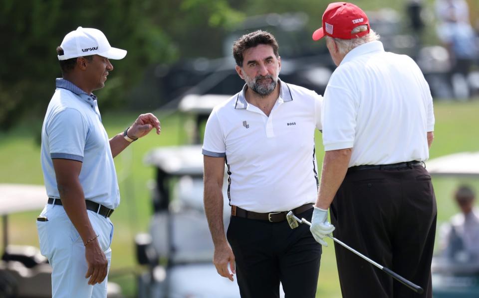Donald Trump chats with Yasir al-Rumayyan (centre), chairman of Newcastle United - GETTY IMAGES