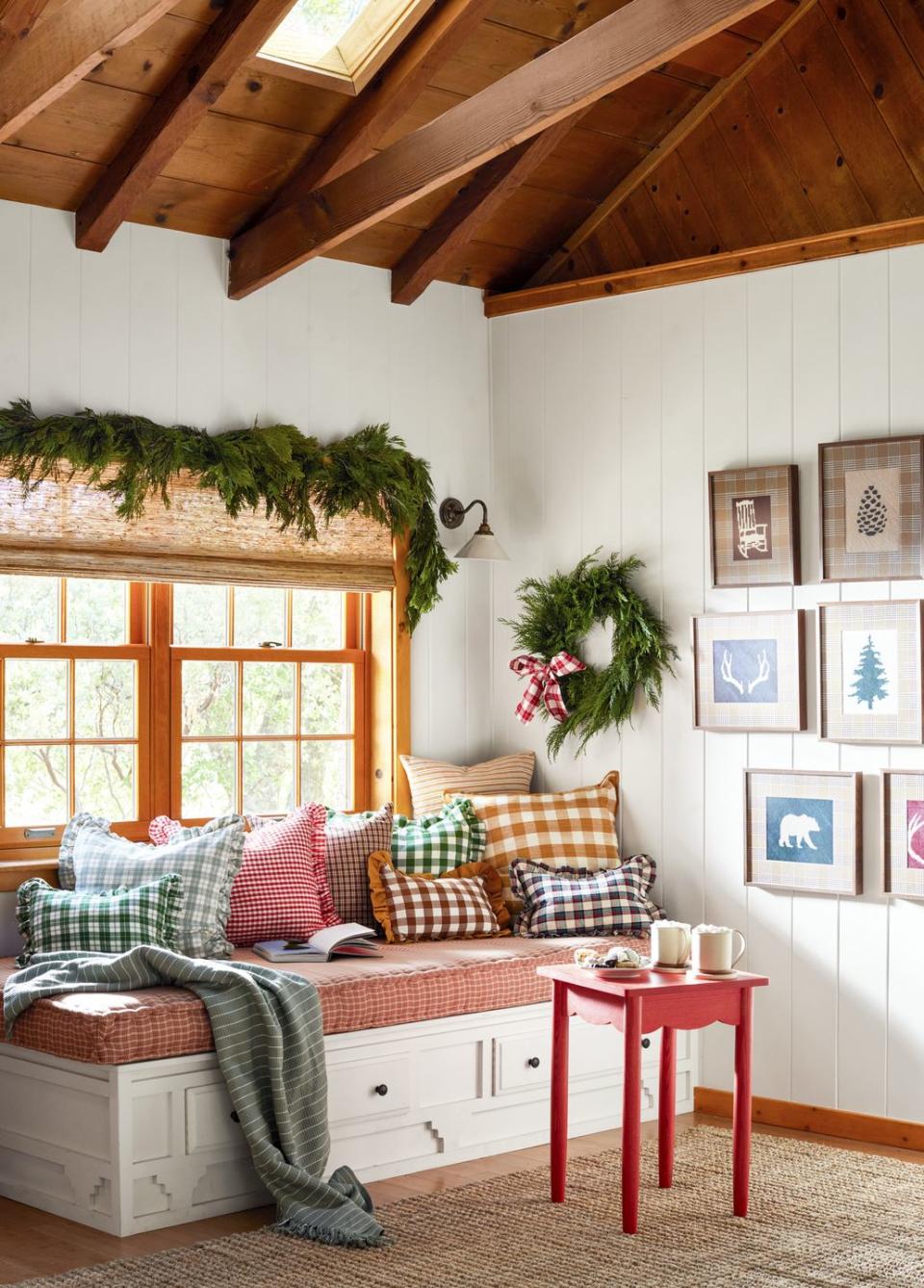 cozy window nook piled up with gingham pillows