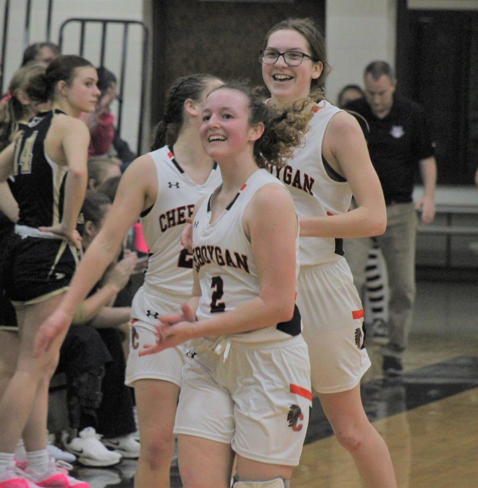Cheboygan's Emily Clark (2), Olivia Patrick and Cloee Rupp were all smiles as the final buzzer sounded in a 33-30 Chiefs victory over St. Ignace on Thursday. Qhc