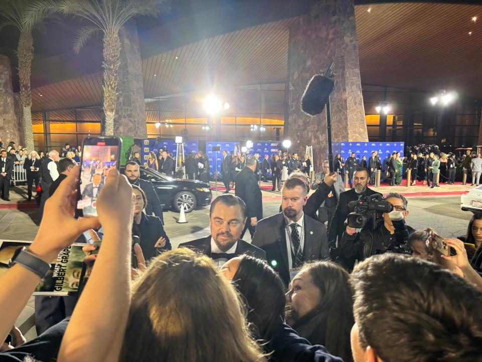 Leonardo DiCaprio of "Killers of the Flower Moon" takes photos with fans at the Palm Springs International Film Awards in Palm Springs, Calif. on Thursday, Jan. 4, 2024.