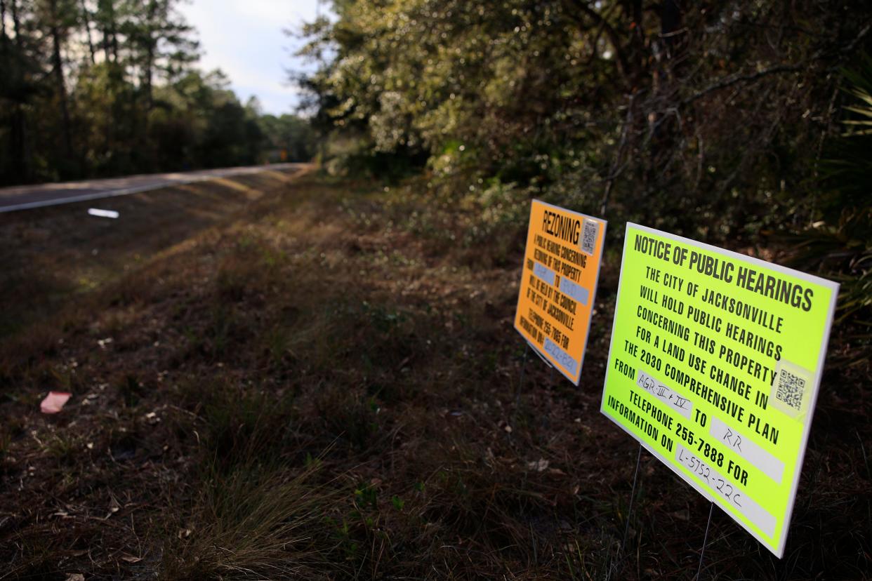 In this January photo, rezoning and land-use hearing notice signs tell people about plans to develop a subdivision surrounded on three sides by Pumpkin Hill Creek Preserve State Park. The rezoning was approved this month by Jacksonville's City Council and challenged in a petitiion to the Florida Division of Adminstrative Hearings.