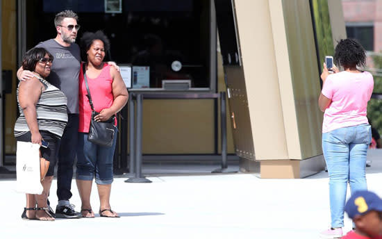 Its seems like Ben Affleck is keeping his chin up by hanging out with his little girl. Ben spent some quality time with his nine-year-old daughter Violet while in Atlanta on Thursday. According to eyewitnesses the 42-year-old star walked hand in hand with Violet while they toured the Atlanta Cyclorama and Civil War Museum. <strong>WATCH: EXCLUSIVE: Ben Affleck Arrives in Atlanta, Where Jennifer Garner Is Filming </strong> Ben also took time to snap photos with his fans while out and about on the cute daddy-daughter date, and eyewitnesses report he seemed to be in good spirits. FameFlynet The two-time Oscar-winner certainly seemed happier than he did on Sunday after returning from his trip to the Bahamas with Jennifer Garner and their three children days after news broke that the Hollywood super couple were getting divorced. Ben and Jen have reportedly been spending a lot of time together since announcing the split. Currently, Ben is said to be living in the guest house of the Atlanta home Jennifer is staying at while shooting her upcoming film <em>Miracles From Heaven.</em> <strong>WATCH: What Ben Affleck and Jennifer Garner's Famous Exes Said About Their Failed Romances </strong> Despite announcing their divorce, both of the stars have been spotted wearing their wedding bands. Ben was still wearing his while hanging out with his little girl on Thursday. The <em> Batman v Superman: Dawn of Justice </em>star is set to make his first official public appearance on Saturday at Comic-Con International in San Diego to promote his highly anticipated debut as the Dark Knight. Ben will be joining his co-stars Henry Cavill and Gal Gadot, as well as director Zack Snyder. For more on Ben's trip to Atlanta check out the video below.