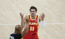 Atlanta Hawks' Trae Young (11) disputes a foul called by a referee during the first half of Game 3 of the NBA Eastern Conference basketball finals against the Milwaukee Bucks, Sunday, June 27, 2021, in Atlanta. (AP Photo/Brynn Anderson)
