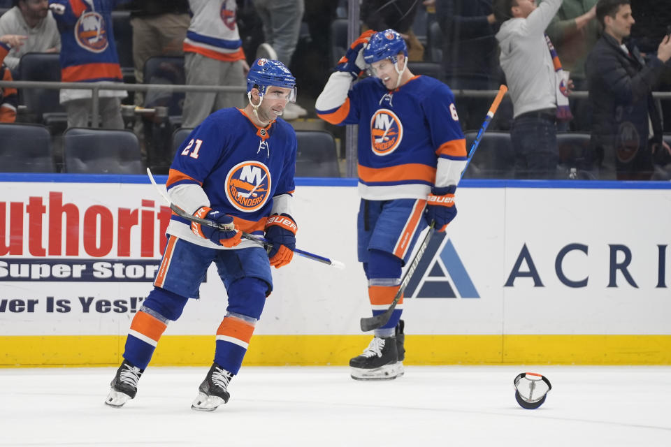 New York Islanders center Kyle Palmieri (21) skates by a cap thrown on the ice by a fan after scoring his third goal in the first period of an NHL hockey game against the Boston Bruins in Elmont, N.Y., Saturday, March 2, 2024. (AP Photo/Peter K. Afriyie)