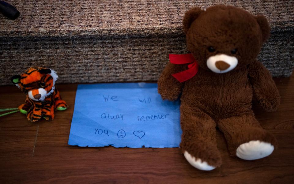 Stuffed animals are left at the altar during a prayer vigil for 10-year-old Iliana “Lily” Peters at Valley Vineyard Church on Monday evening (AP)