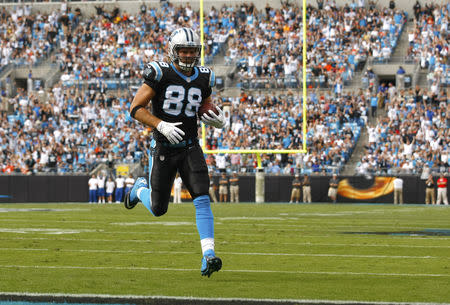 Carolina Panthers tight end Greg Olsen (88) runs into the end zone for a touchdown against the Denver Broncos during an NFL football game in Charlotte, North Carolina November 11, 2012. REUTERS/Chris Keane