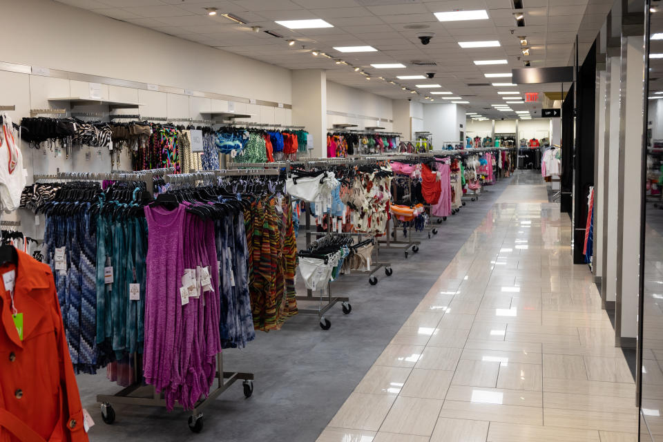 A women’s department, on rolling racks.