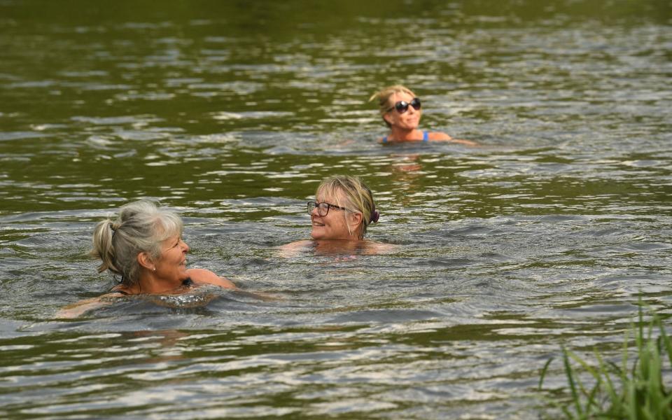 "When we do go in, we all swim heads-up, breaststroke. Nobody does crawl"; wild swimmers on the River Avon in Fordingbridge, Hampshire