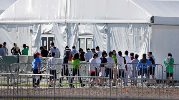 PHOTO: Children line up to enter a tent at the Homestead Temporary Shelter for Unaccompanied Children in Homestead, Fla., Feb. 19, 2019. (Wilfredo Lee/AP, FILE)