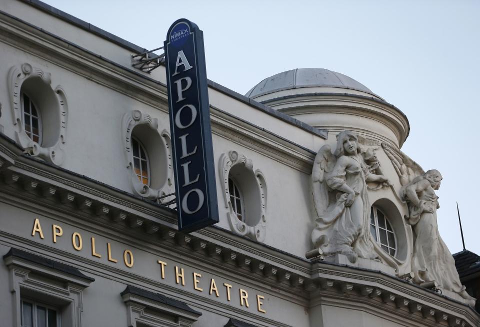 The exterior of the Apollo theatre is seen on the morning after part of it's ceiling collapsed on spectators as they watched a performance, in central London, December 20, 2013. Emergency services said nearly 90 people were injured on Thursday when part of the ceiling collapsed during a performance at a packed London theatre, bringing the city's West End entertainment district to a standstill. The audience was showered with masonry and debris following the incident at the Apollo Theatre, where about 720 people including many families were watching the hugely popular play "The Curious Incident of the Dog in the Night-Time". REUTERS/Suzanne Plunkett (BRITAIN - Tags: DISASTER ENTERTAINMENT)