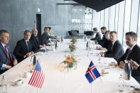 Icelandic Foreign Minister Gudlaugur Thor Thordarson, second right, sits opposite US Secretary of State Antony Blinken, second left, during a at the Harpa Concert Hall in Reykjavik, Iceland, Tuesday, May 18, 2021. Blinken is touting the Biden administration's abrupt shift in its predecessor's climate policies as he visits Iceland for talks with senior officials from the world's Arctic nations. (Saul Loeb/Pool Photo via AP)