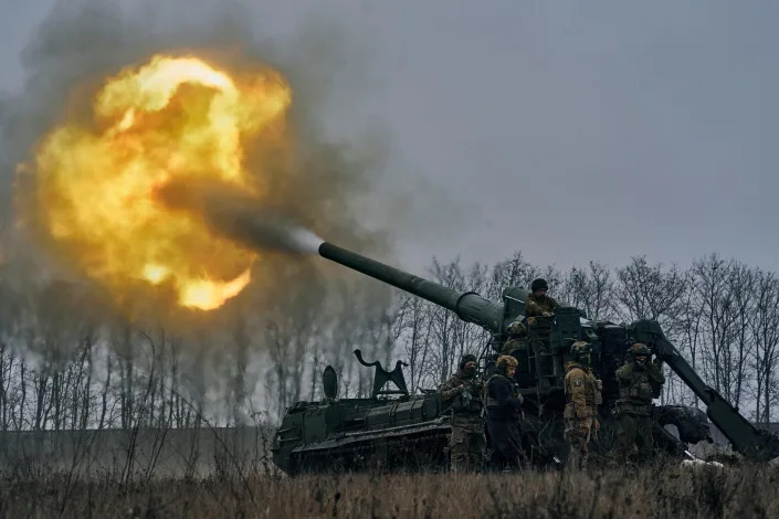 Ukrainian soldiers fire a Pion artillery system at Russian positions near Bakhmut, Donetsk region, Ukraine, Friday, Dec. 16, 2022.