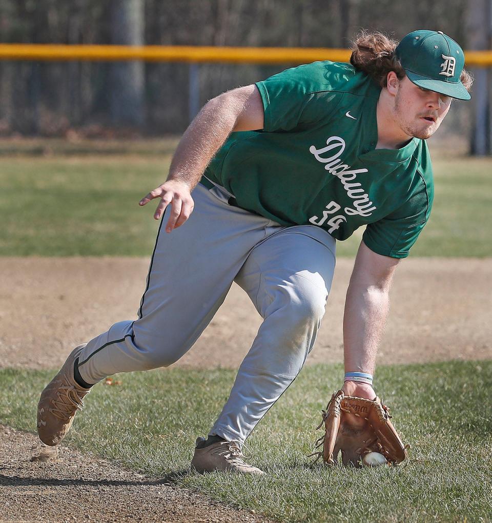 Dragons third baseman Nick Ayres who is hot slugging early in the season makes a play on a grounder to third.Duxbury hosted Silver Lake High in baseball  on Friday April 14, 2023 