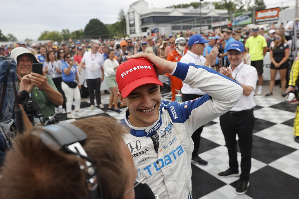 Alex Palou celebrates after winning an IndyCar race at Road America in Elkhart Lake, Wisc., Sunday, June 20, 2021. (AP Photo/Jeffrey Phelps)