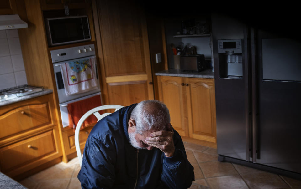 David Tonkin sits in his kitchen at his home in Perth, Australia, Sunday, July 21, 2019. Tonkin blames his son's death on a system that allowed him to see 24 different doctors and get 23 different medications from 16 different pharmacies _ all in the space of six months. Between January and July 2014 alone, Matthew Tonkin got 27 prescriptions just for oxycodone. (AP Photo/David Goldman)