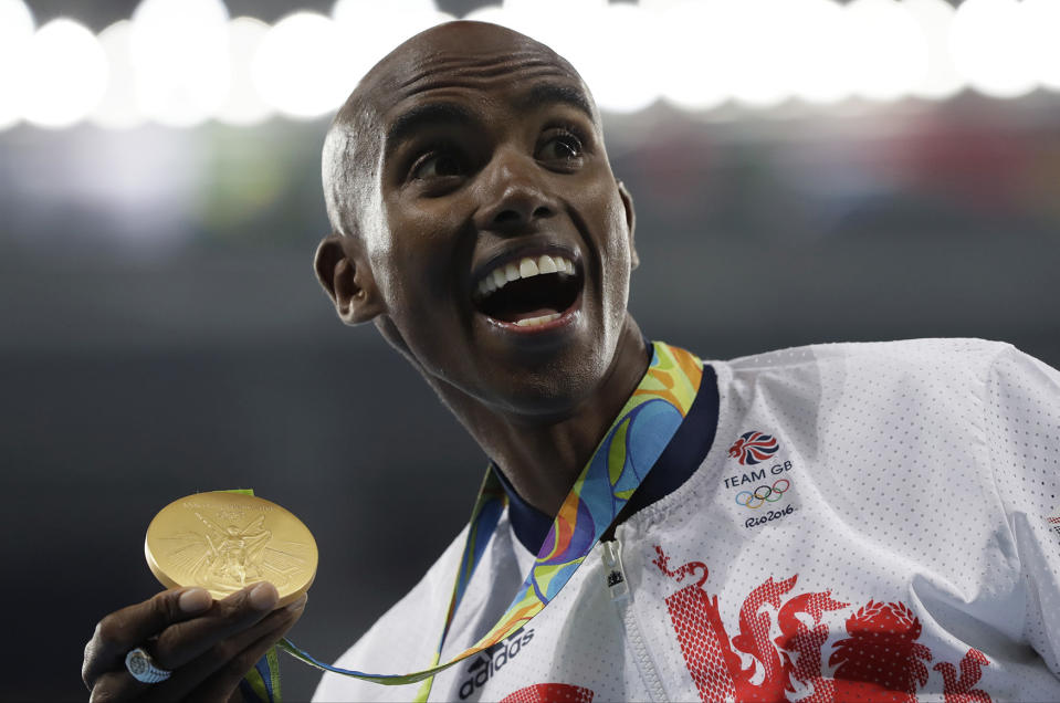 Farah celebrates with the gold medal