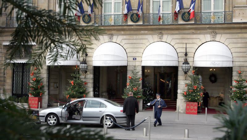 A doorman greets guests in front of the Christmas decorated Ritz four star hotel, located at Place Vendome in Paris, Wednesday Dec. 6, 2005. A guest lost a ring there valued at more than $800,000.