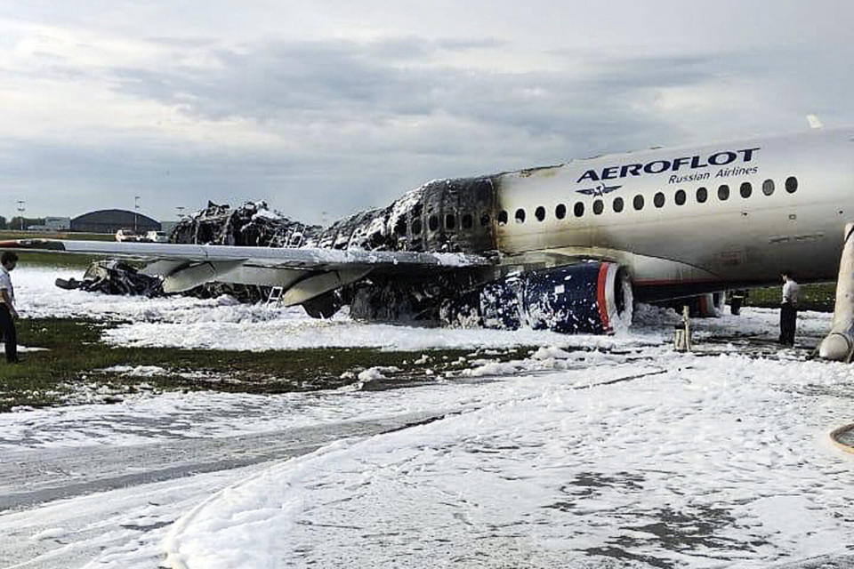 The Sukhoi Superjet 100 aircraft of Aeroflot Airlines is covered in fire retardant foam after an emergency landing in Sheremetyevo airport in Moscow, Russia, on Sunday. Source: AAP