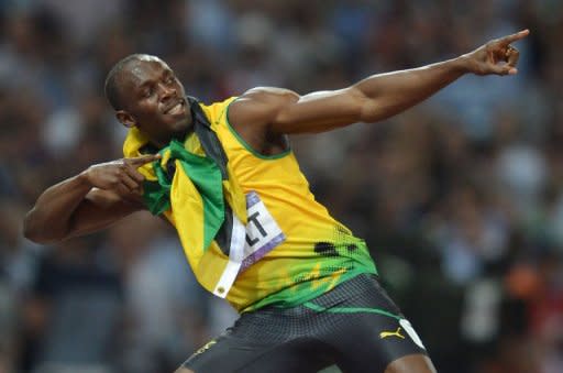 Jamaica's Usain Bolt celebrates after taking the gold in the men's 200m final at the athletics event during the London 2012 Olympic Games in London