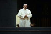 Pope Francis attends a vigil prayer on the eve of the XIV General Assembly of the Synod of Bishops at St Peter's basilica on October 3, 2015 at the Vatican