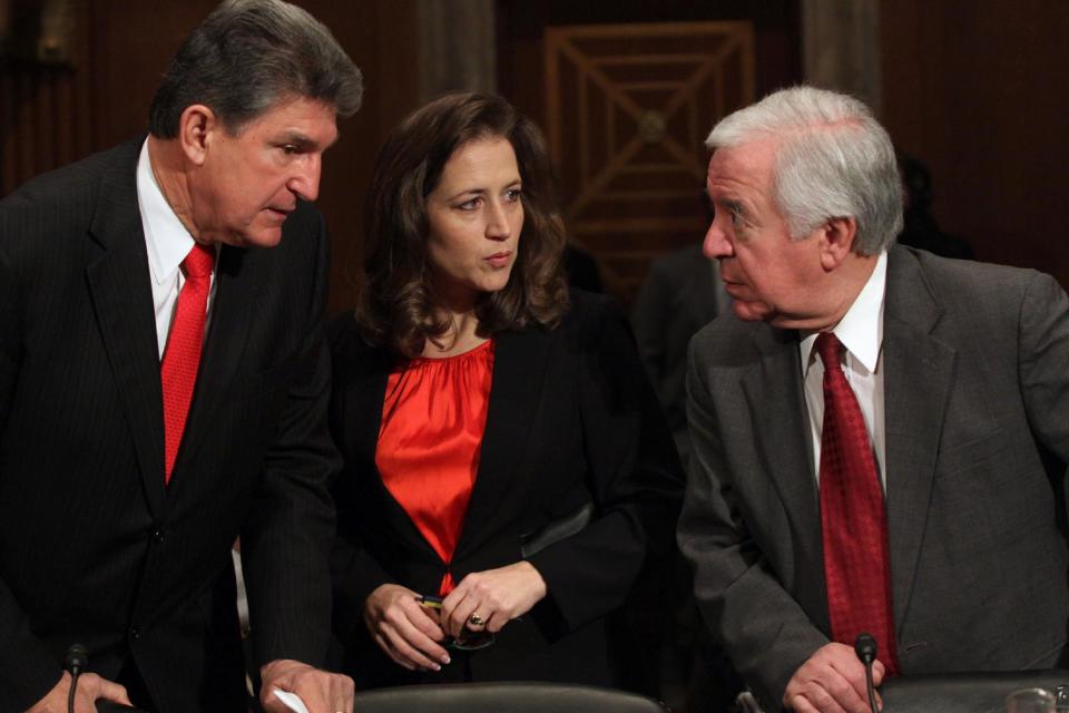 From left, Sen. Joe Manchin, D-W.Va., West Virginia Secretary of State Natalie Tennant, and Rep. Nick Rahall, D-W.Va. confer on Capitol Hill in Washington, Tuesday, Feb. 4, 2014, prior to testifying before the Senate subcommittee on Water and Wildlife hearing to examine the safety and security of drinking water supplies following the Central West Virginia drinking water crisis. (AP Photo/Lauren Victoria Burke)