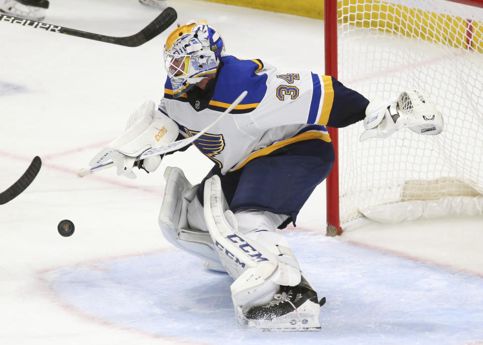 St. Louis Blues goalie Jake Allen (34) makes a save during the first period of an NHL hockey game against the Buffalo Sabres, Tuesday, Dec. 10, 2019, in Buffalo, N.Y. (AP Photo/Jeffrey T. Barnes)
