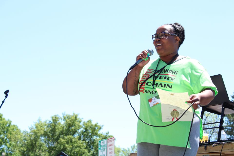 Robin Scott, the executive director of We All Rise: African American Resource Center, speaks to attendees at the Juneteenth celebration at Joannes Park, Saturday, June 18, 2022, in Green Bay.