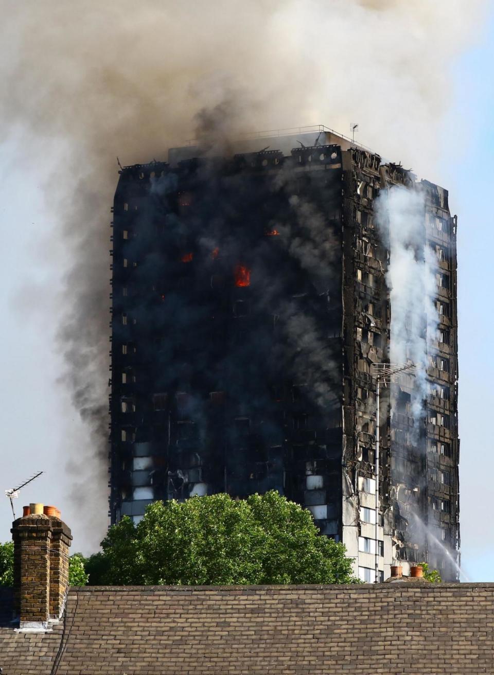 Smoke billows from the fire that engulfed the 24-storey Grenfell Tower (Rick Findler/PA)