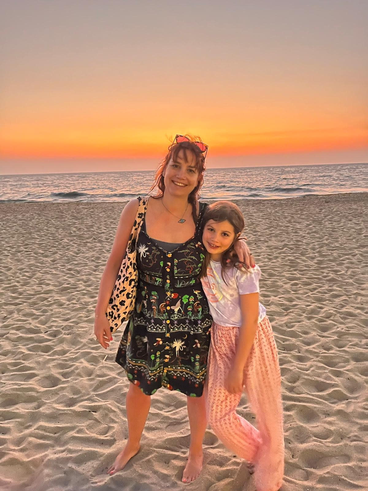 Sarah Stevenson and Luna on a beach in Kerala, India, 2024. (Supplied)