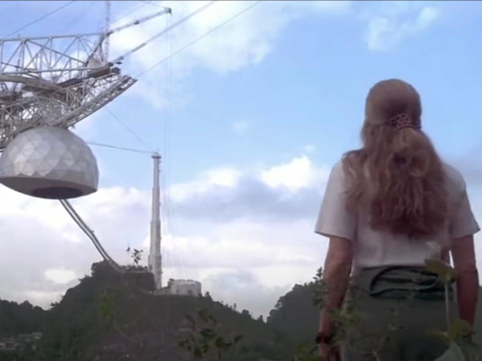 A screenshot of Jamie Foster from the movie "Contact" looking at the Arecibo Observatory