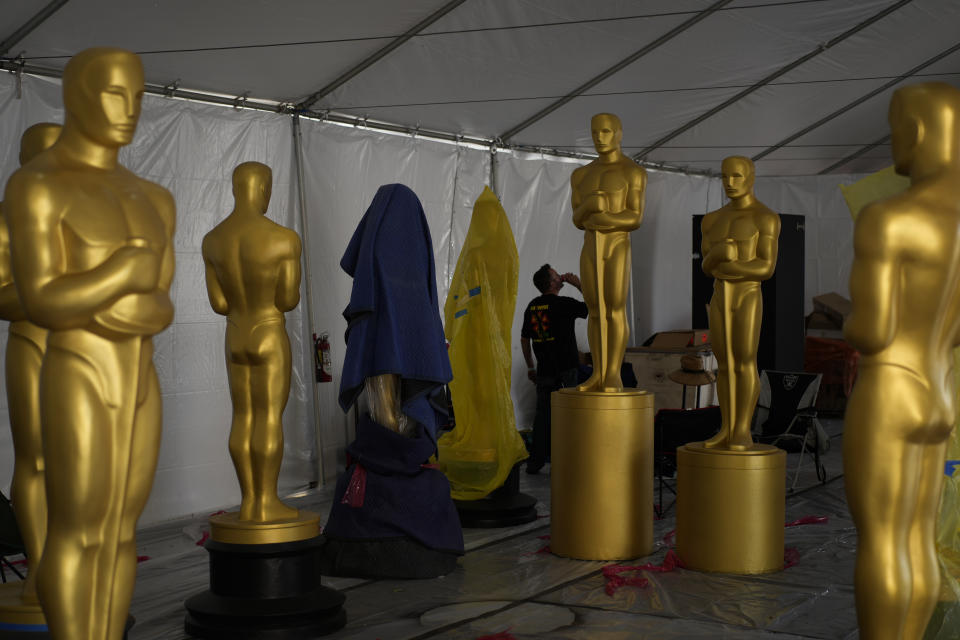 Oscar statues sit in a tent during preparations for Sunday's 94th Academy Awards outside the Dolby Theatre on Friday, March 25, 2022, in Los Angeles. (AP Photo/John Locher)